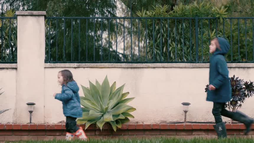 Little girls play in the garden