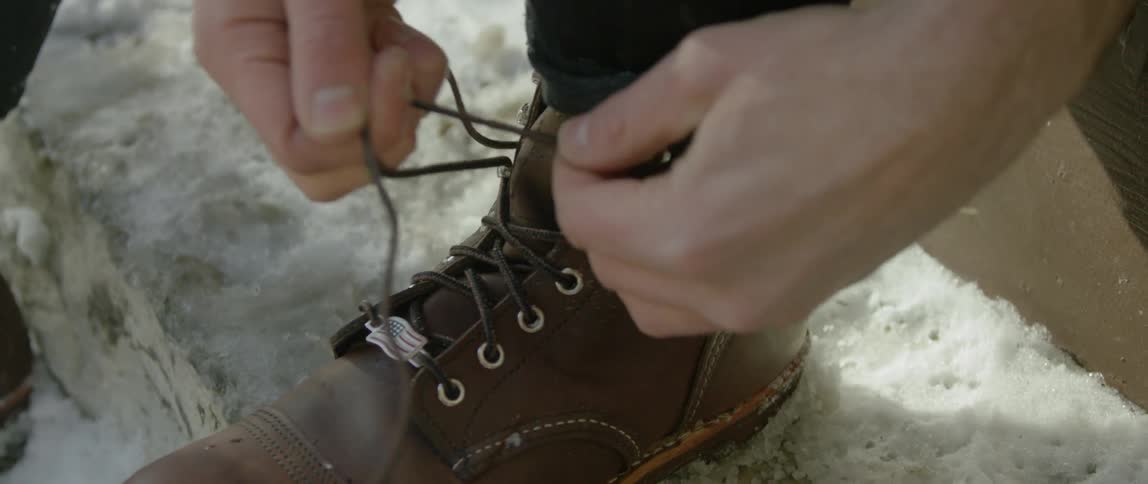 A person tying their shoes