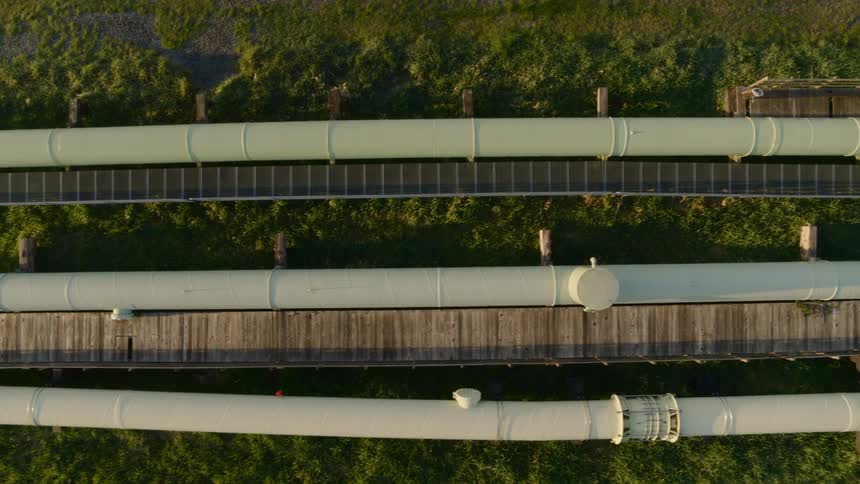 Overhead view of pipelines that go from above ground to underground