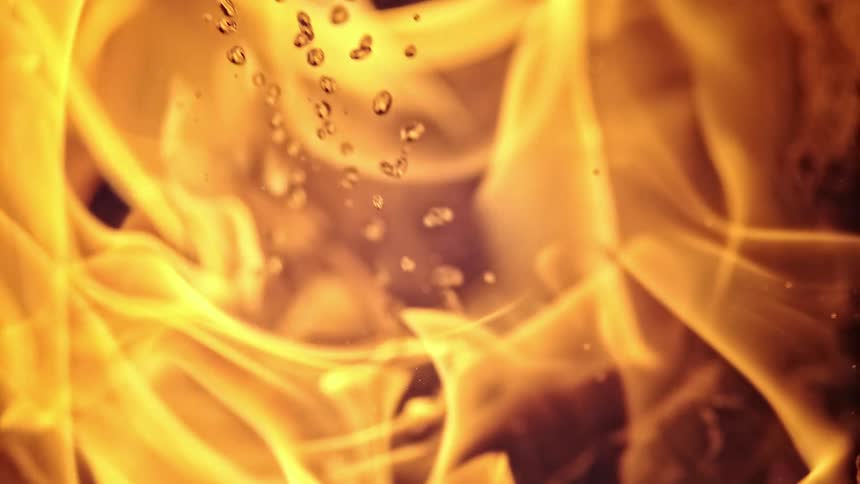 Material burns and produces flames that send out heat and light