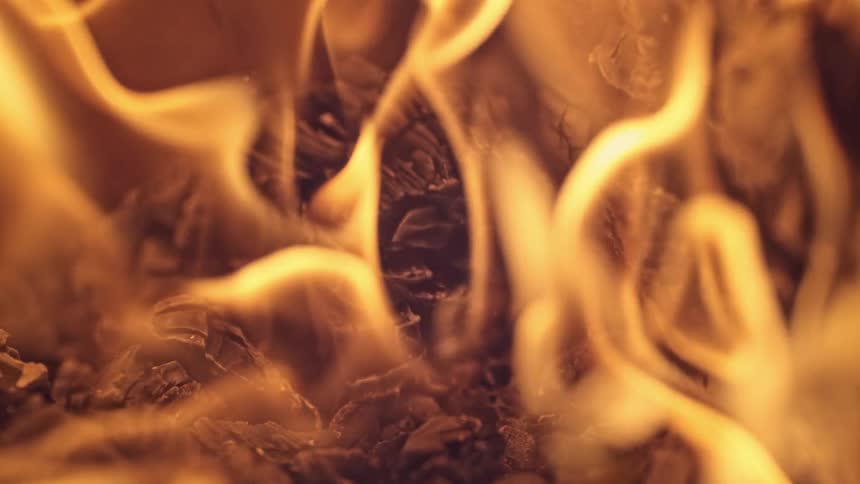 A fire starts and flames grow taller