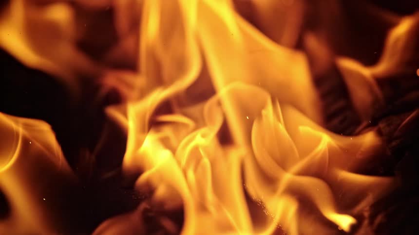 Flames burning at night