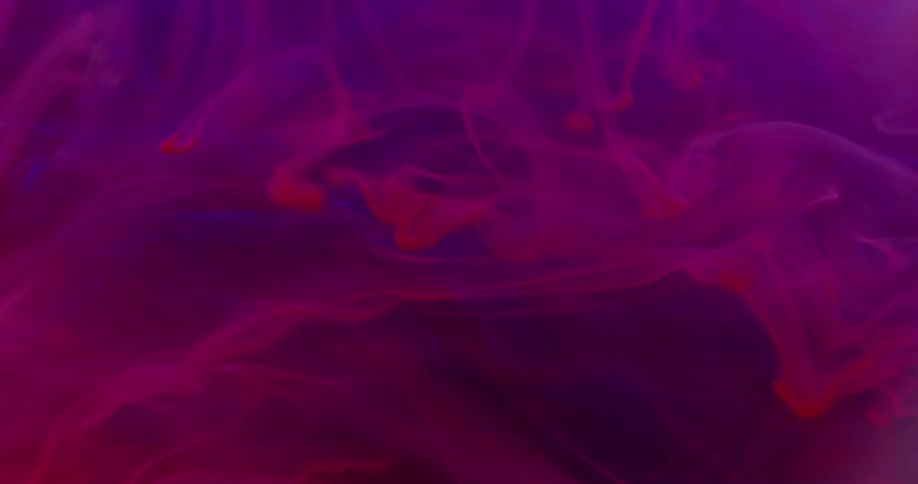 Abstract footage of dyes mixing together