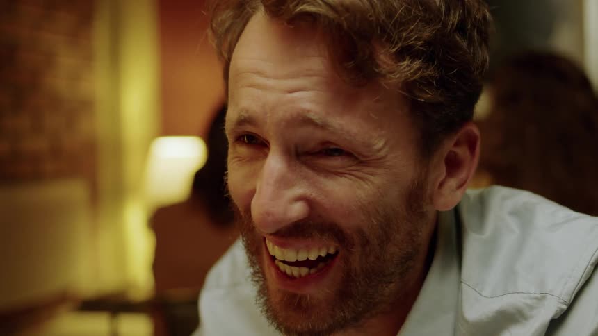 A man laughs heartily