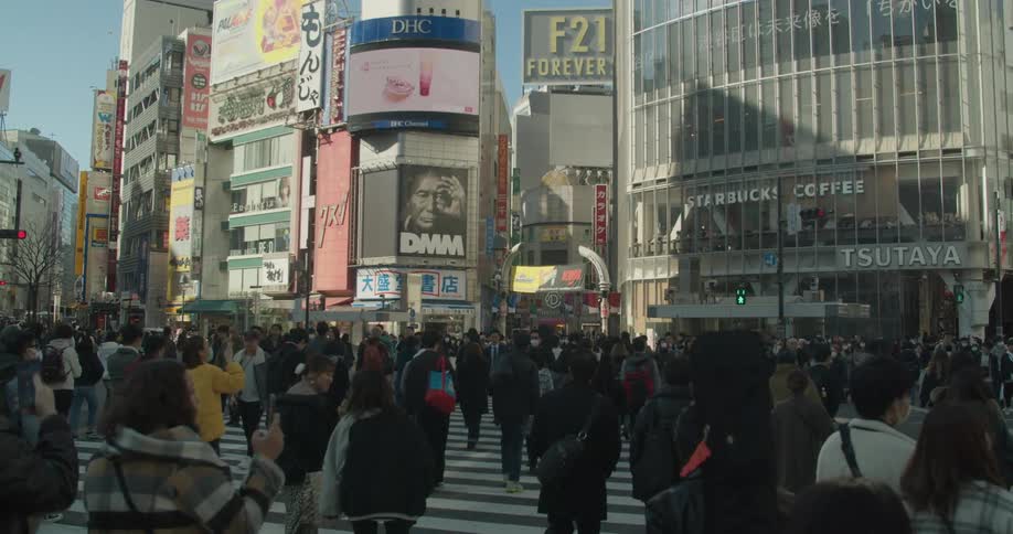 A large crowd of people at Shibuya Crossing in Tokyo