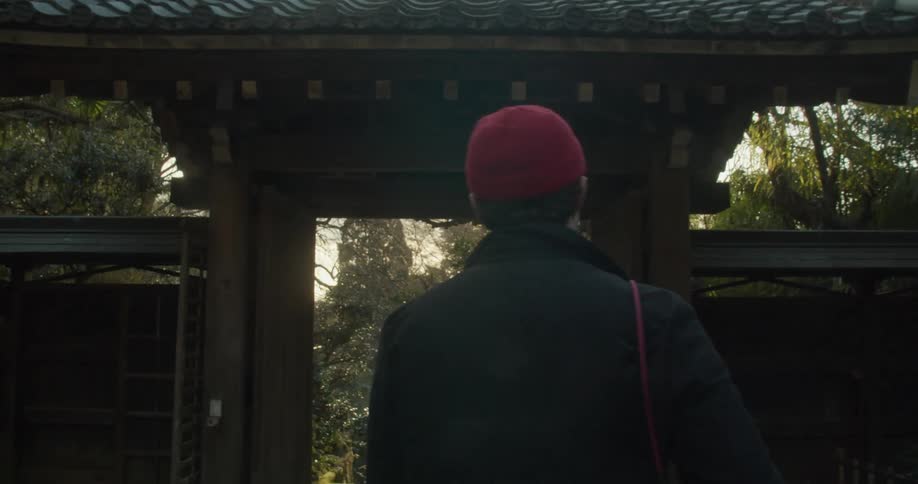 A man looks around as he walks