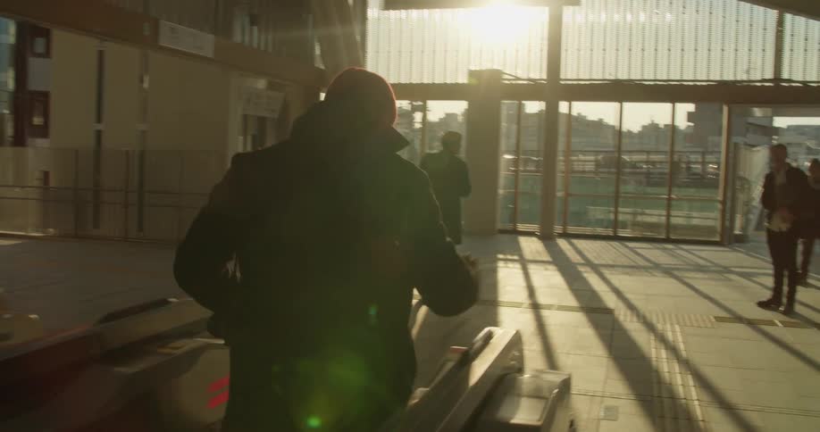 People walk throughout the building