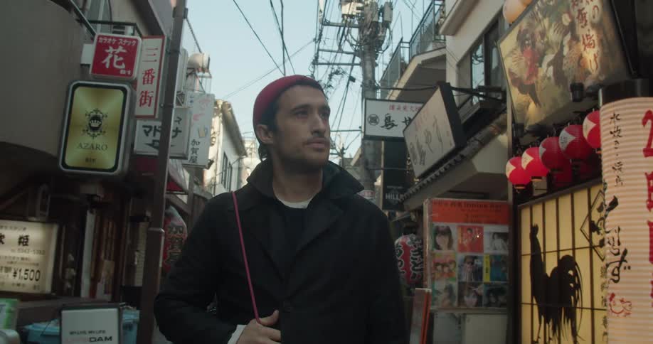 Man walks down the street and looks at the shops