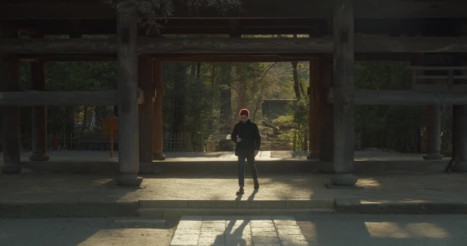 A man is walking in a nature area