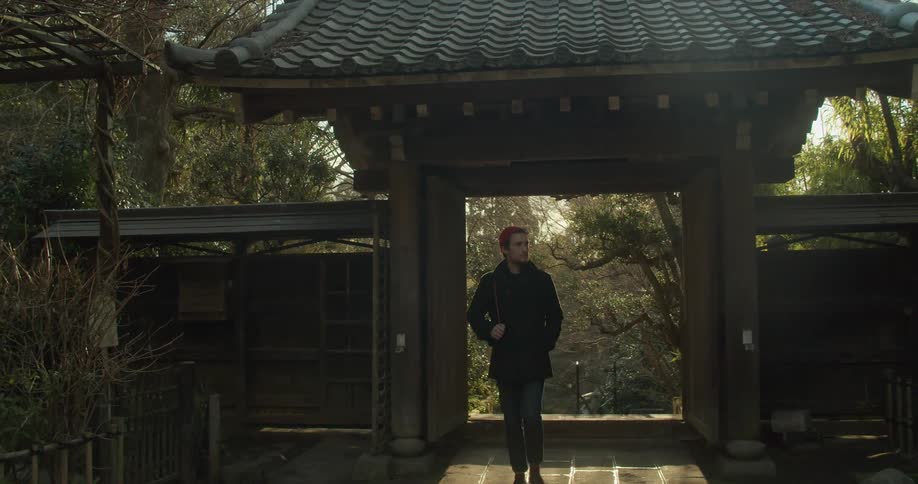 A man walks through the path in the park