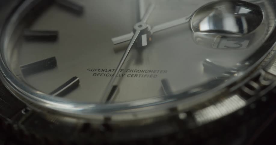 The second hand of a watch moves around the face