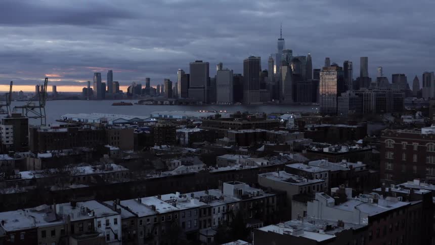 The taller buildings are in the distance of the city