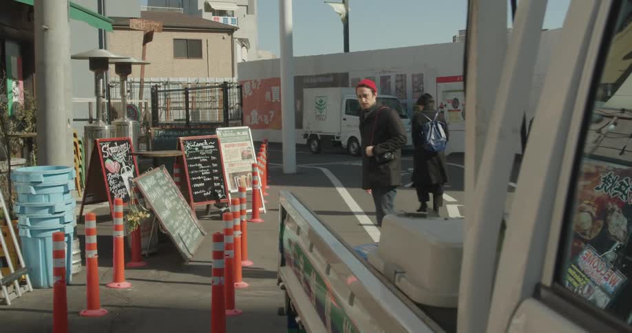 A man skateboards passed the store