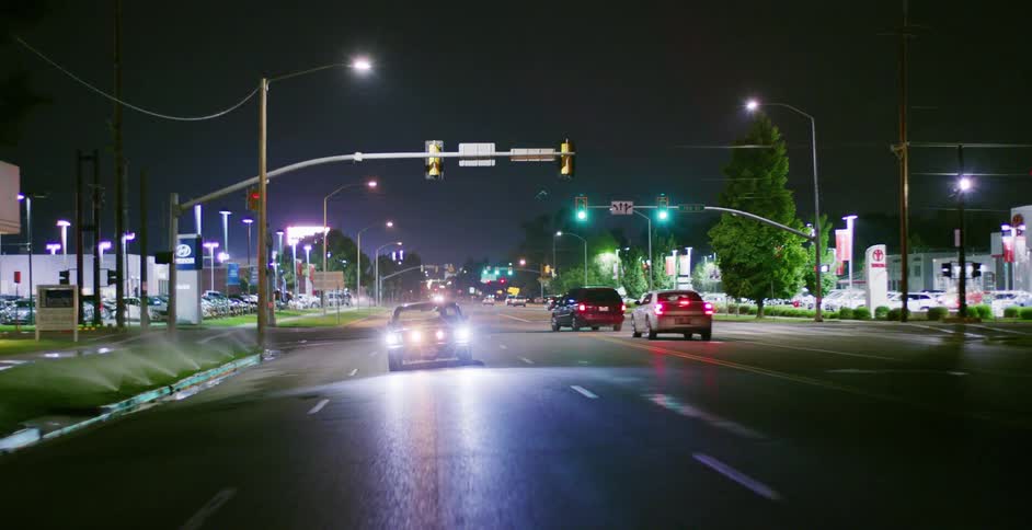 Cars driving down a city street