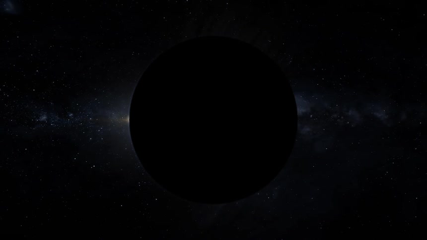 An eclipse moves behind a planet in space