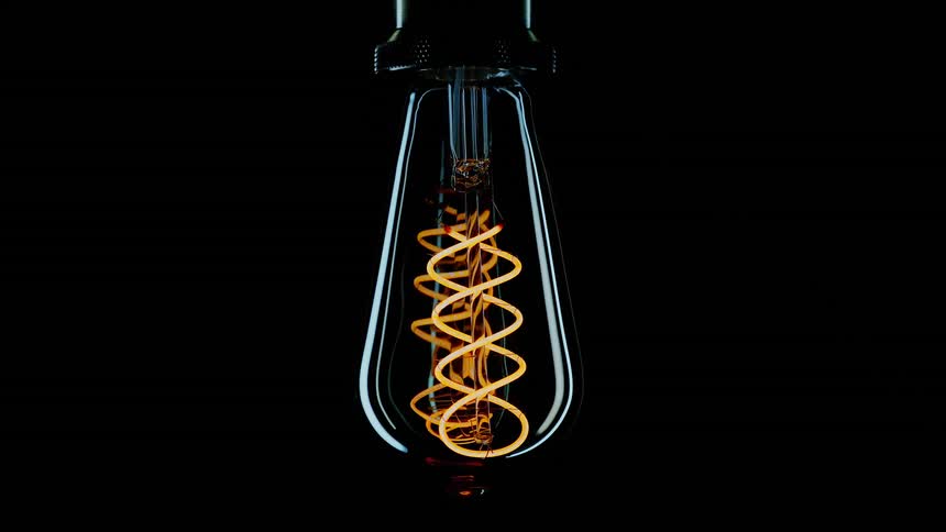 An ersatz model of a light bulb flickers with neon light