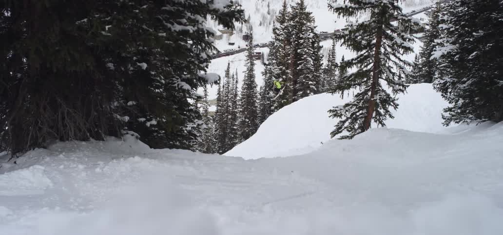 A person skiing down a snowy slope