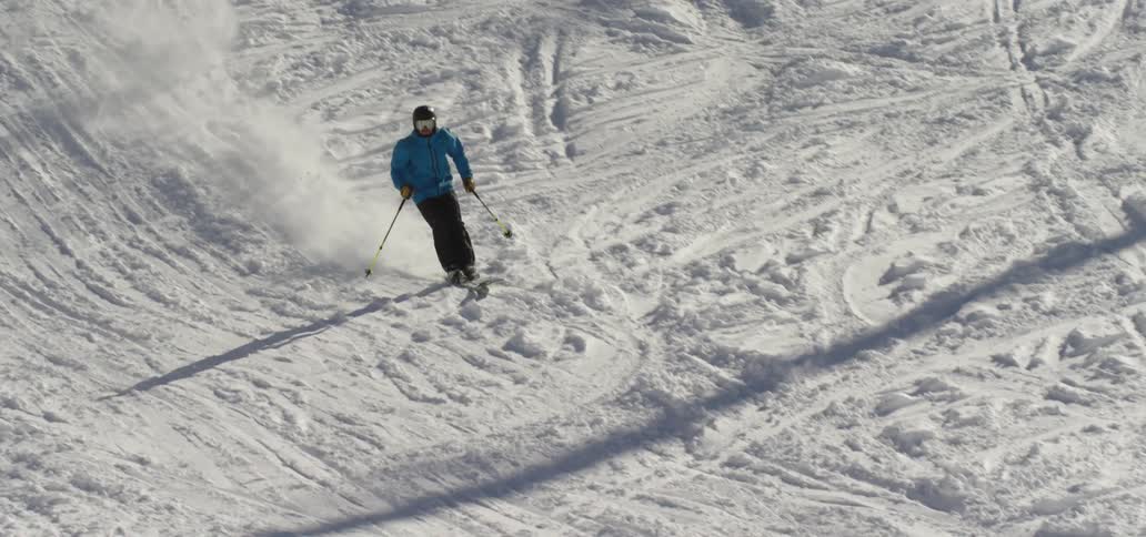 A person skiing down a hill