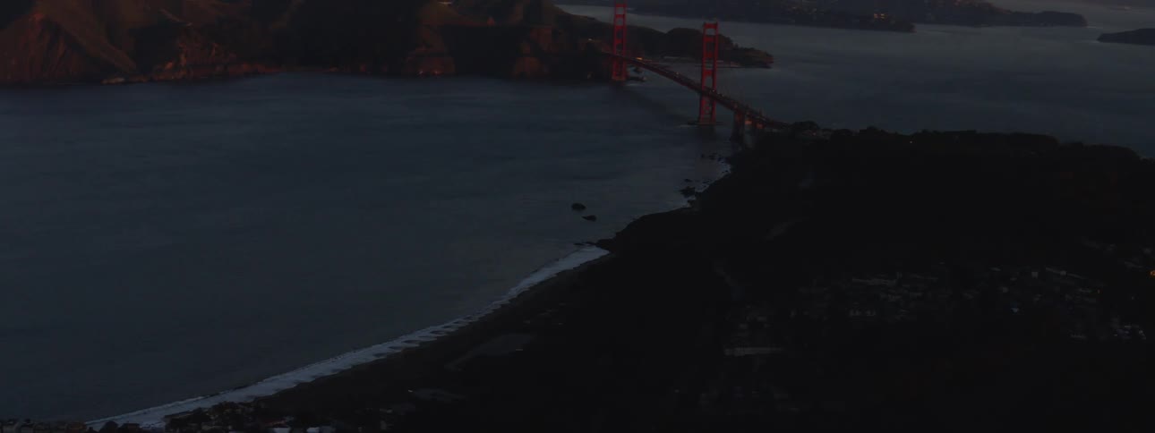 The bridge sits high next to the homes
