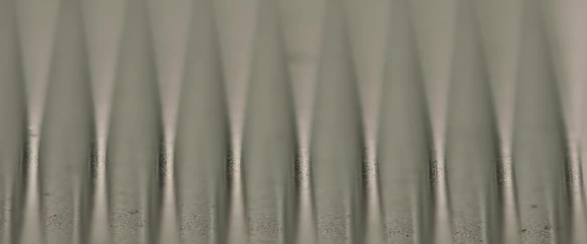 Several tapered shapes flow downward