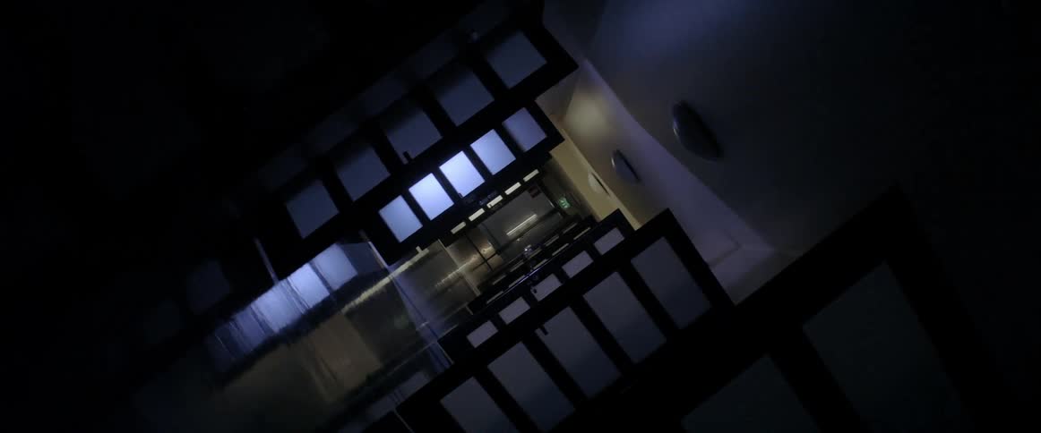 Lights flash in a dark hallway filled with open doors
