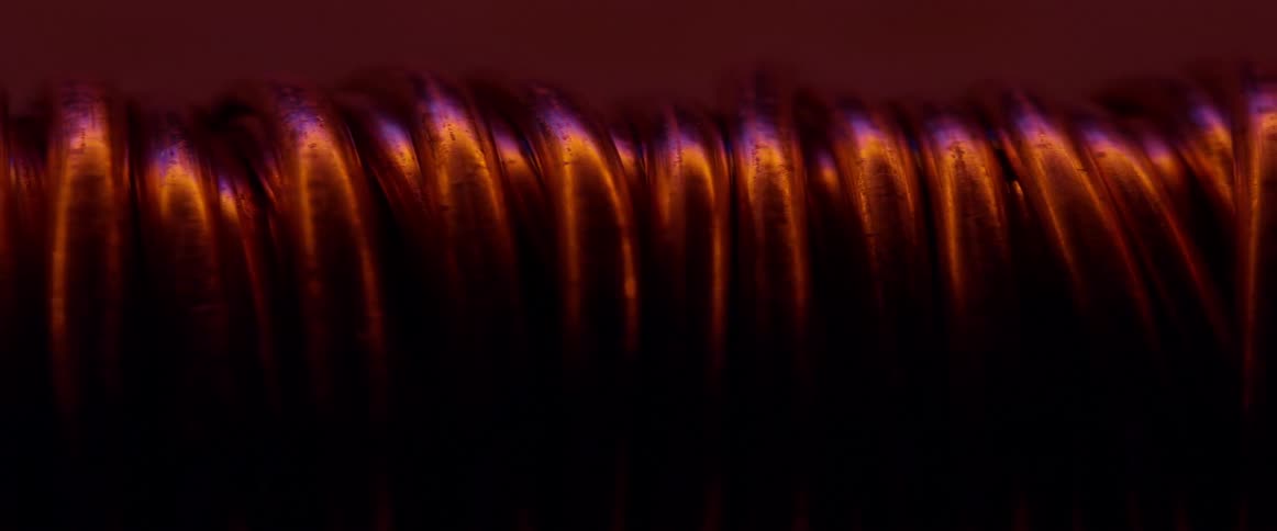 Metal coils reflect blue and red lignt