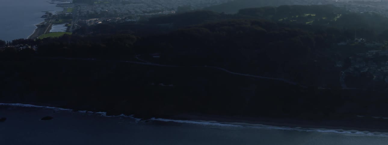 The city in the distance is covered with fog