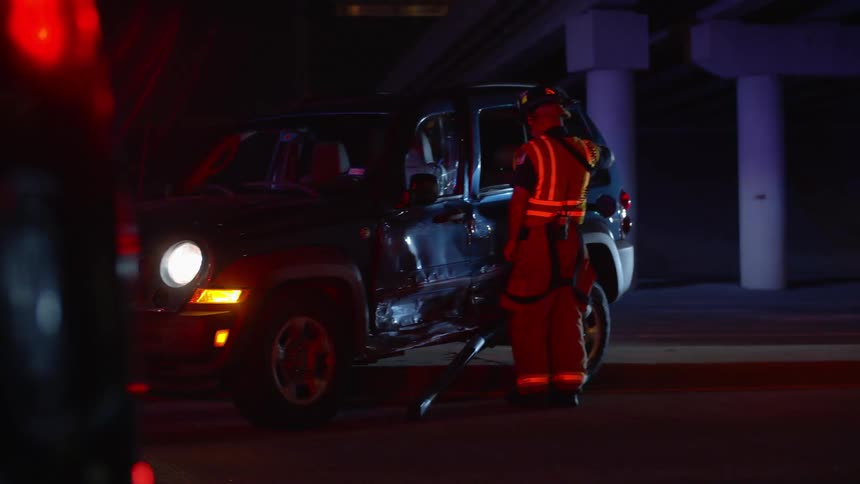 The fire men look into a vehicle