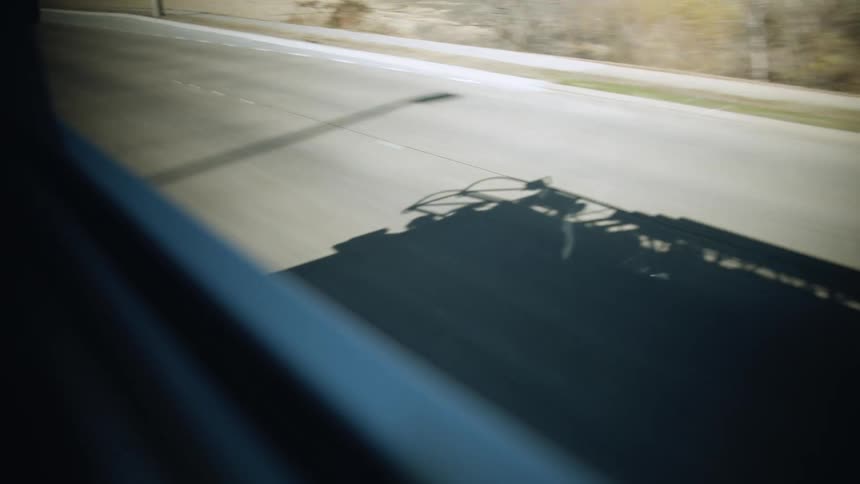 The vehicle drives down the road
