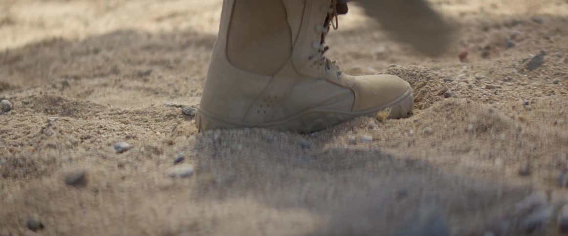 The boot kicks the sand
