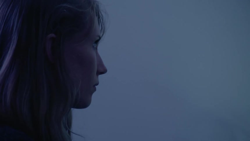 A woman is standing in a room