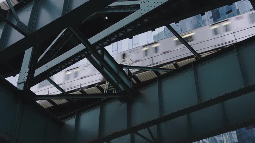 A train with buildings in the background