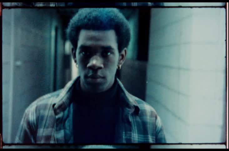 A man walking down a hallway