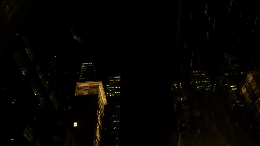 City lights shine against night dark in downtown