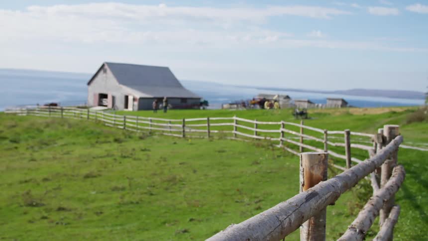 View of the house on the edge of the hill surrounded by fences