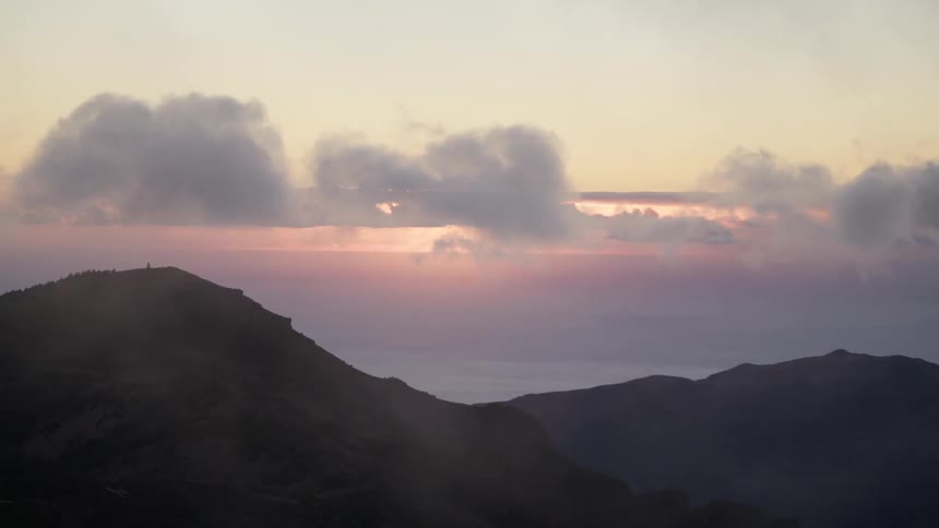 Fog covered mountains at sunset