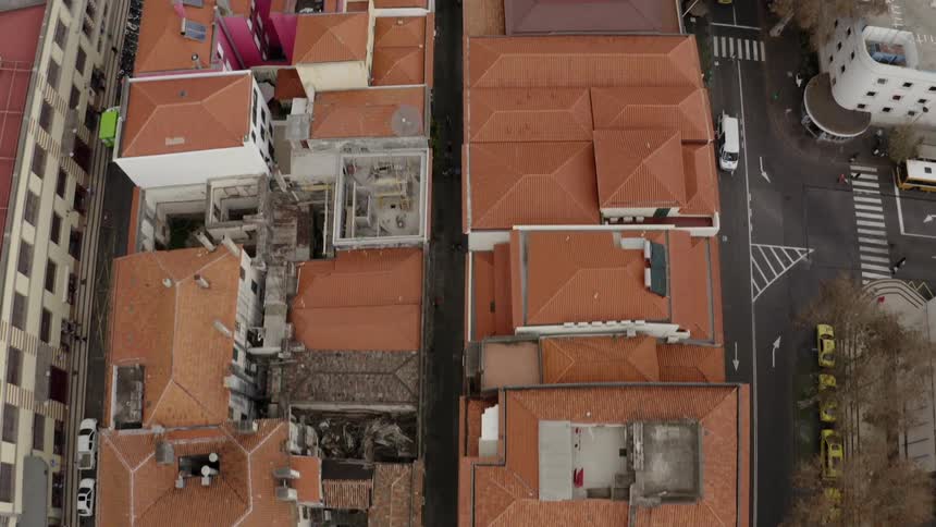 The rooftops of city apartment buildings with courtyards some rundown and dilapidated
