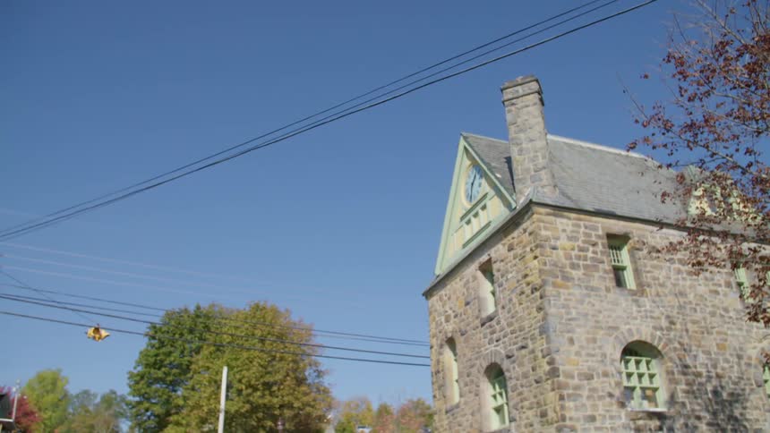 A brick building with a clock on it