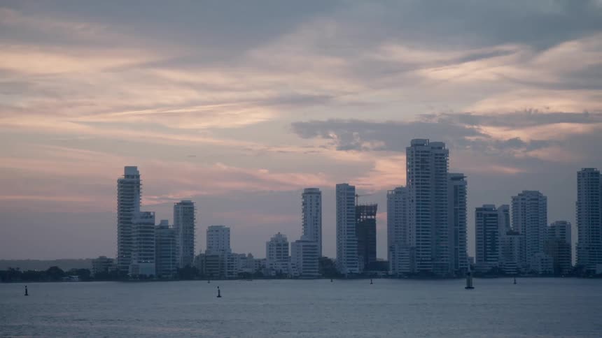 The city skyline behind the water