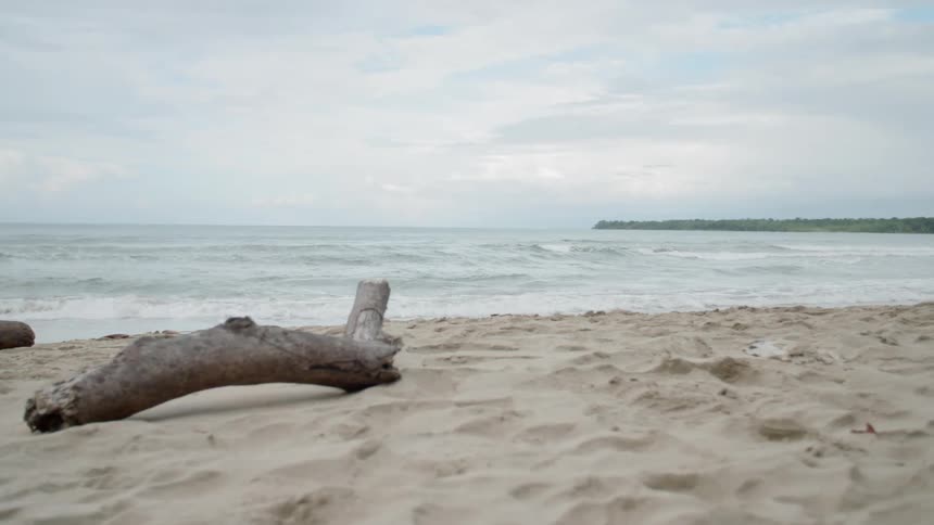 Ocean waves come ashore on a beach