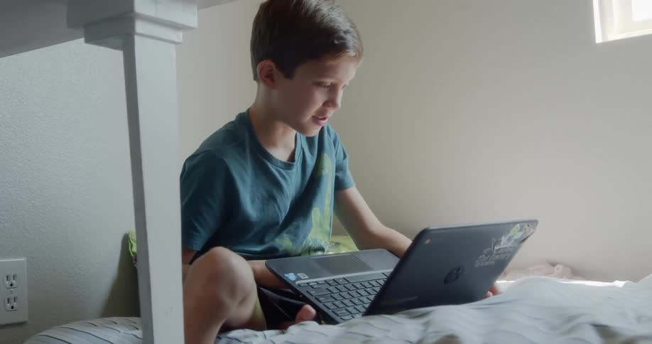 The child talks on the computer