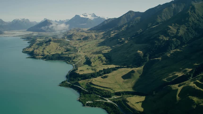 Mountains rise up from a shoreline