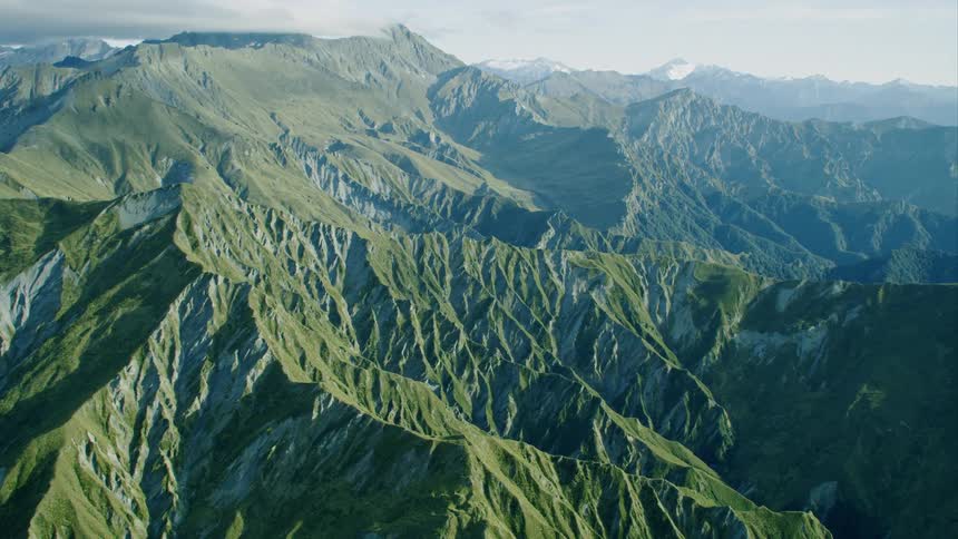 A mountain range with the sky in the background