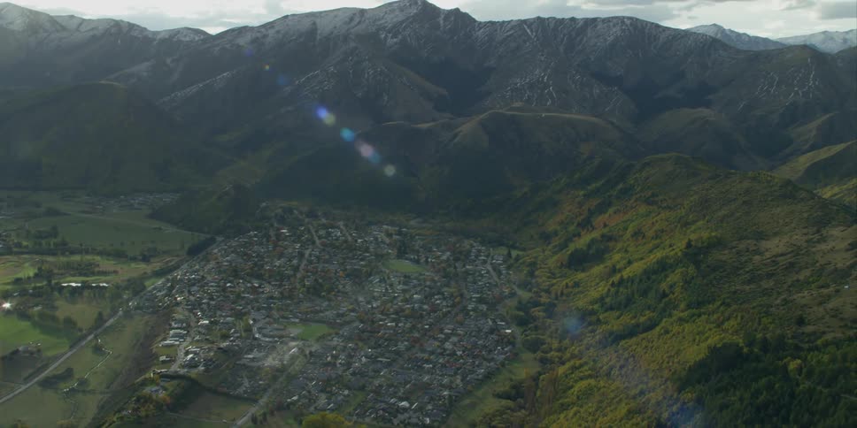 A small town sits nestled in a mountain valley