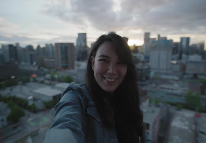 Selfie of a woman on a rooftop