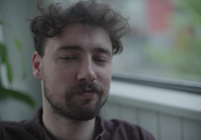 The man looks at the film