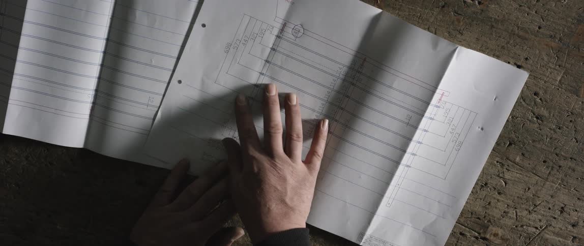 A man looks at a design in an office