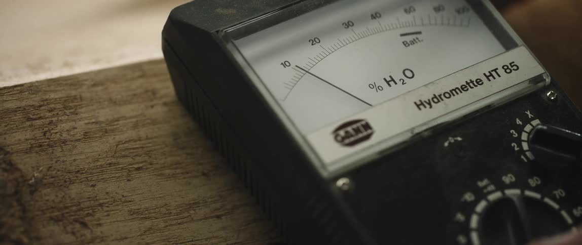 A person fiddles with a hydrometer