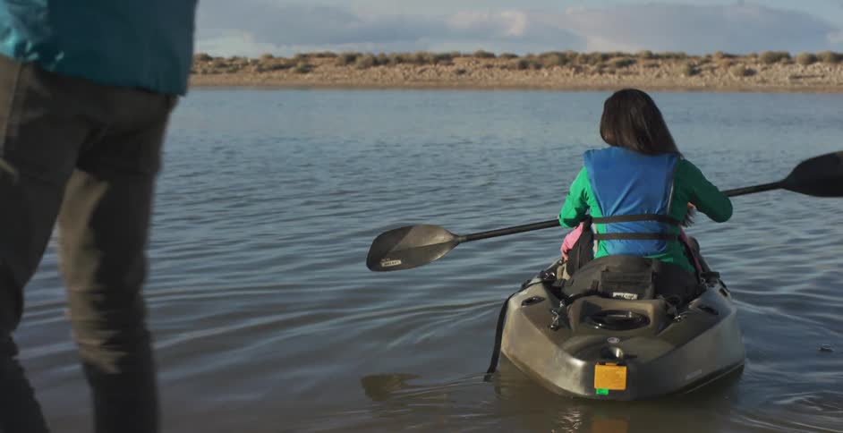Mother and child on a kayak in a lake