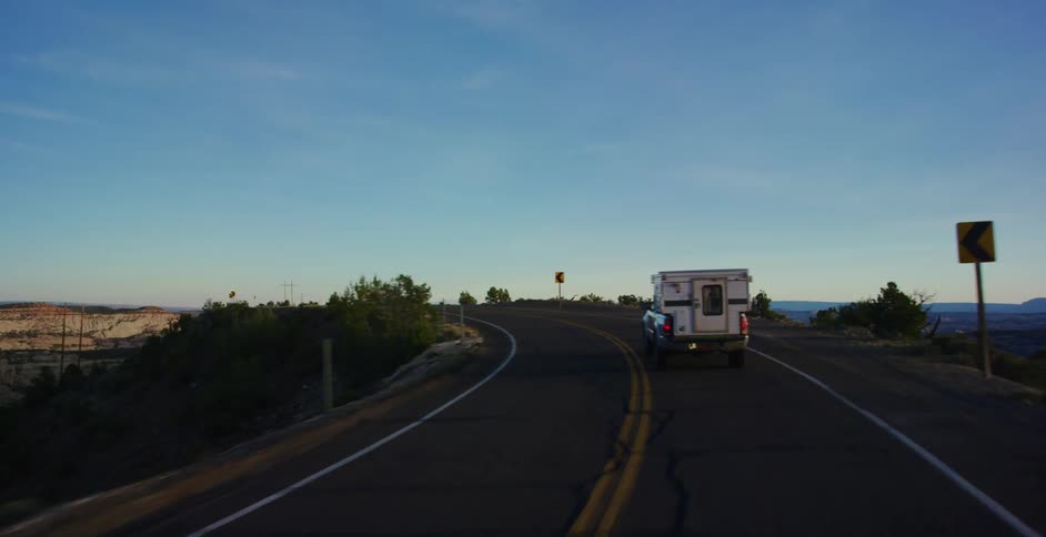 Camper traveling on a highway through the desert